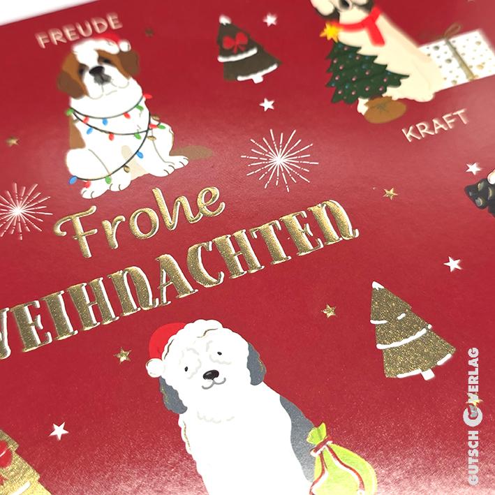 Eine rote Weihnachtskarte mit Illustrationen von Hunden, goldenem Text und festlichen Symbolen wie Bäumen, Sternen und Feuerwerk.