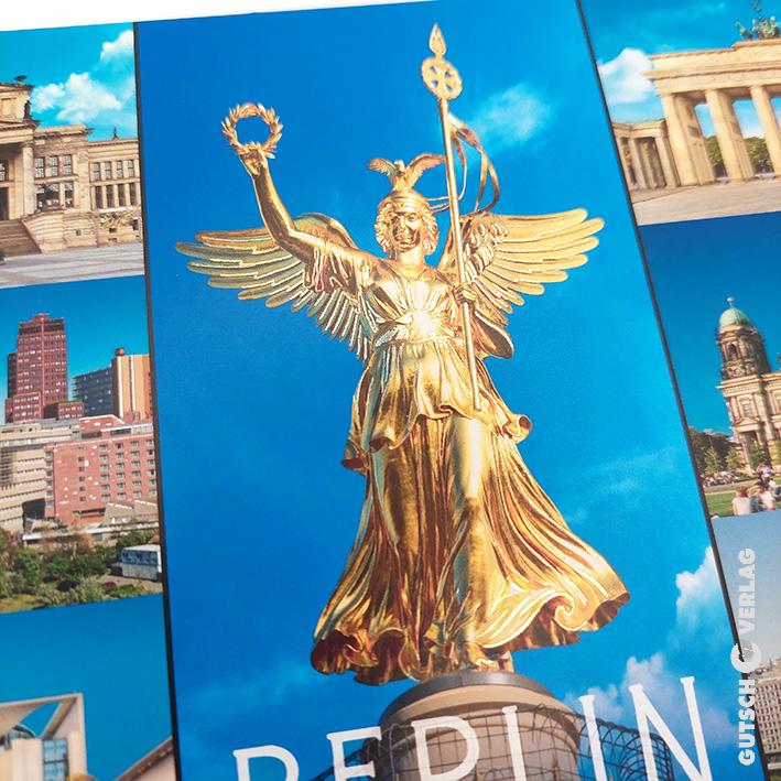 Goldene Statue der Siegessäule in Berlin vor einem strahlend blauen Himmel, die ikonische Wahrzeichen zur Schau stellt.