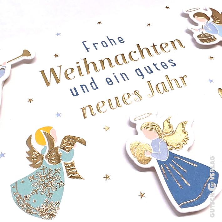 Eine Weihnachtsgrußkarte mit Goldfolientext und Illustrationen von Engeln, die vor einem Sternenhintergrund Instrumente spielen.